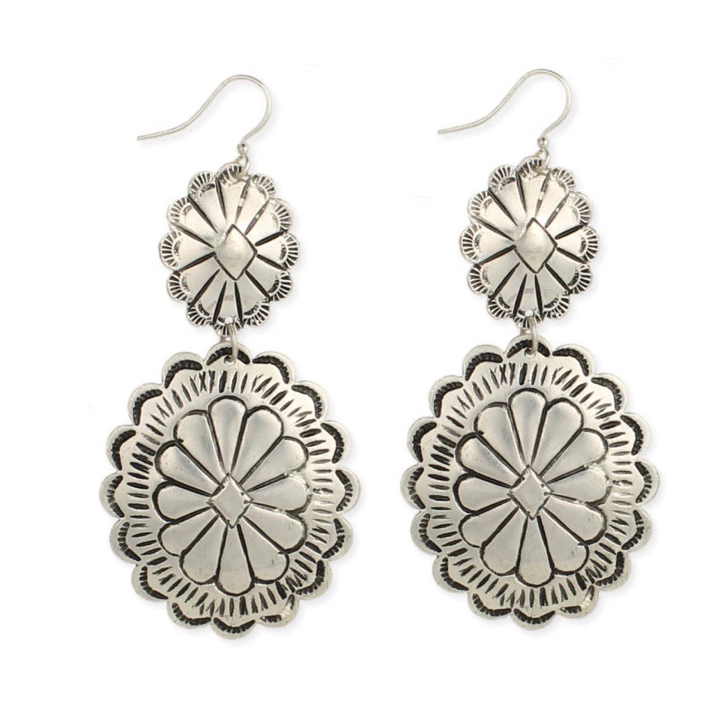 Silver plated concha drop earrings.