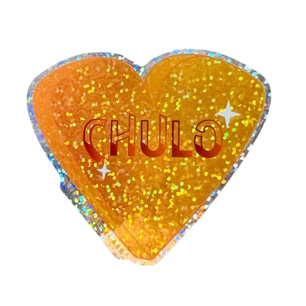 Yellow and glittery heart sticker with the phrase Chulo in the center. Translation: good looking male