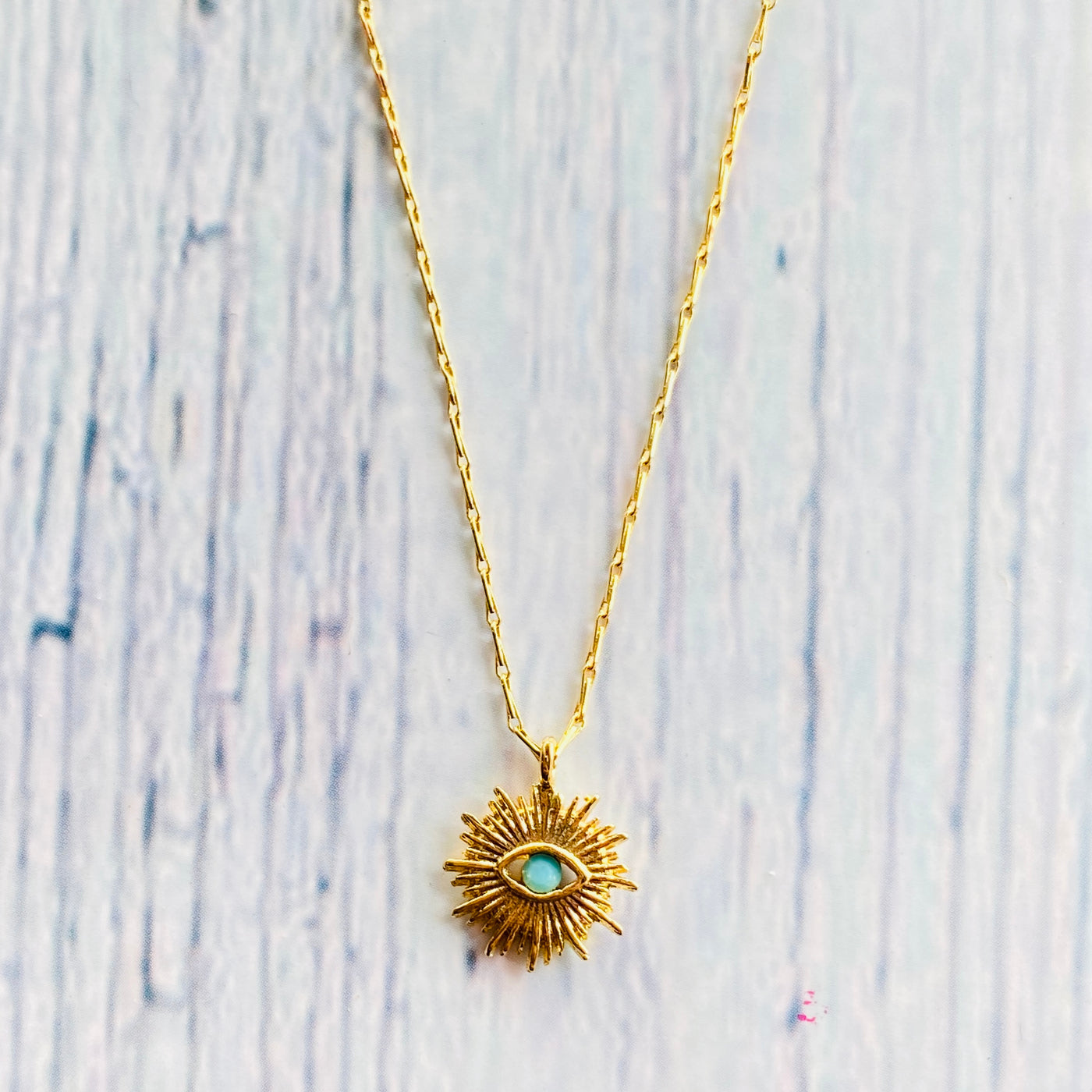 Gold plated brass evil eye protection necklace.