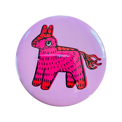 Light pink button mirror with a hot pink Piñata.