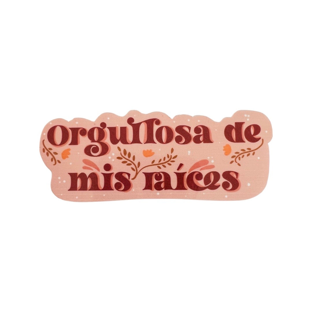 Orange and sienna sticker with phrase Orgullosa De Mis Raices in sienna lettering.
