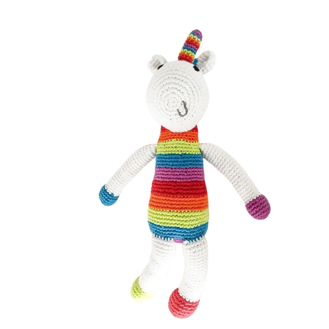 White unicorn crochet with a rainbow horn and abdomen.