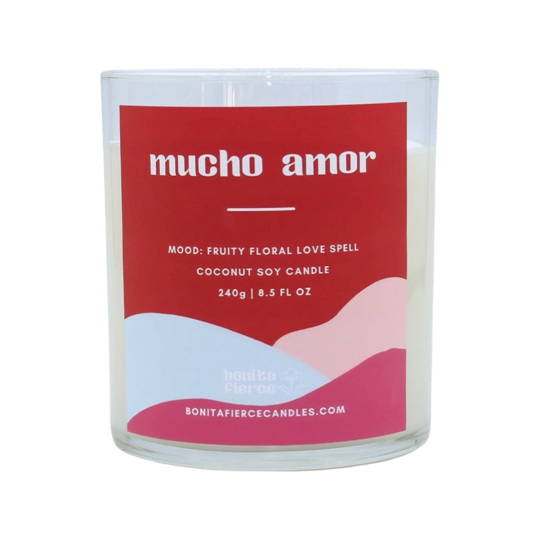 8.5 oz candle with the phrase Mucho Amor of red, white and pink branded label. Translation: A lot of love