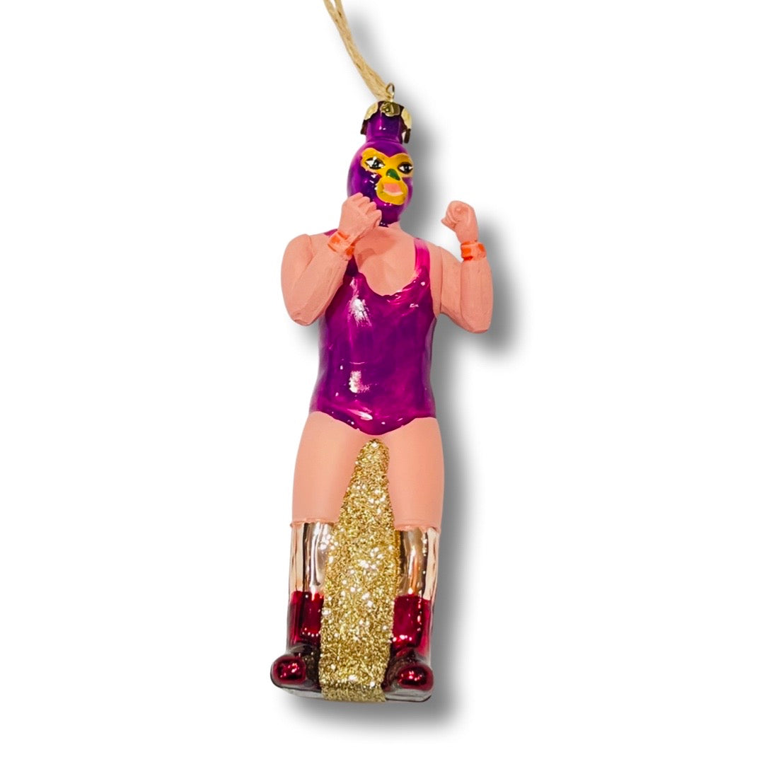 Hand-painted glass Luchador ornament in purple with glitter accents.