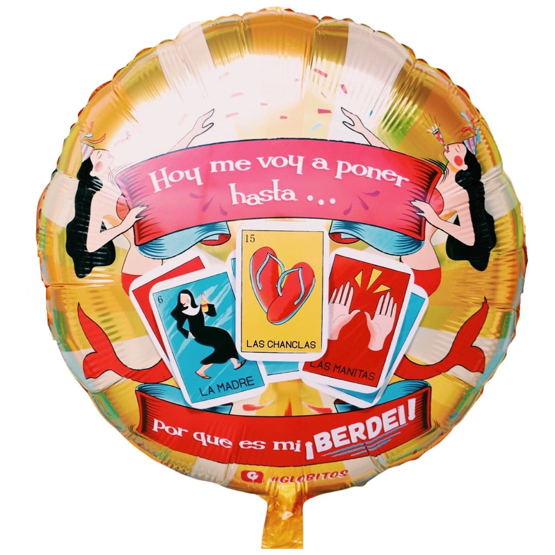 Loteria themed birthday balloon reads, "Hoy me voy a poner hasta...por que es mi berdei." Graphic features two mermaids wearing party hats and three different loteria themed cards: la madre, las chanclas, and las manitas. Majority of the balloon is gold with multicolored graphics.