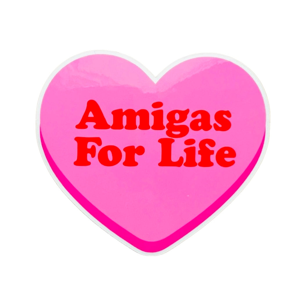 Pink heart with the phrase Amigas For Life in red lettering