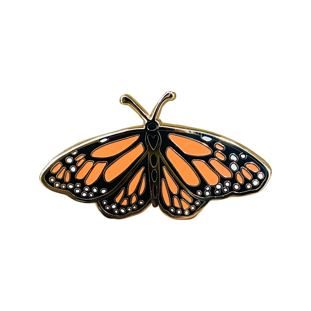 Monarch butterfly enamel pin.