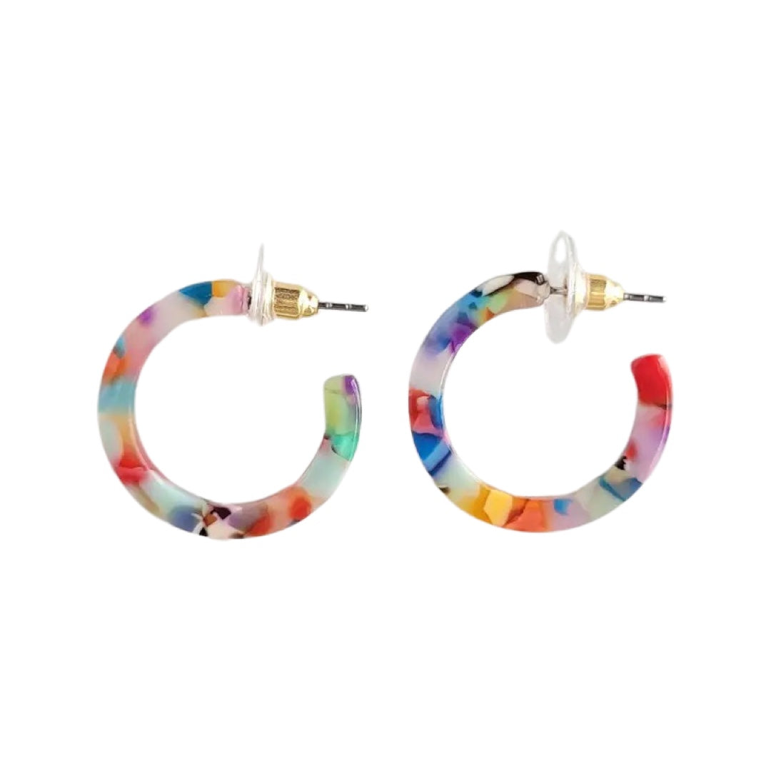 A set of rainbow confetti acrylic hoop earrings
