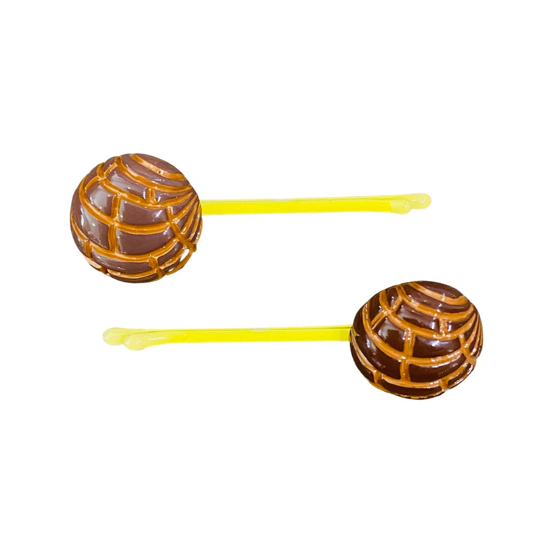 Brown concha (type of Mexican sweet bread) bobby pins.