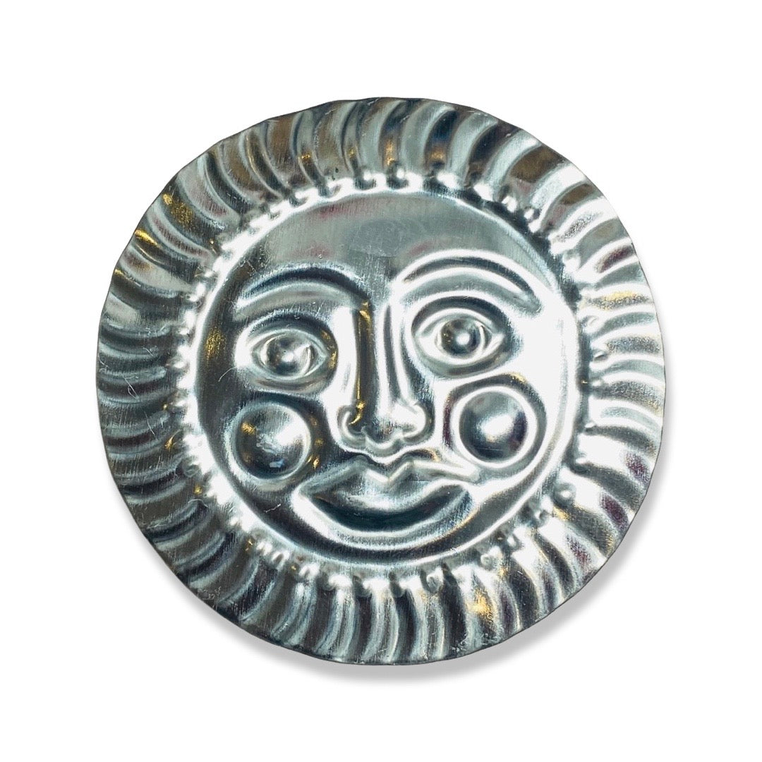 Tin napkin ring with el sol (sun) design.