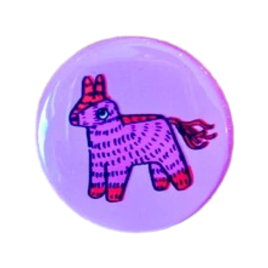 Pink round pin button with a pink pinata