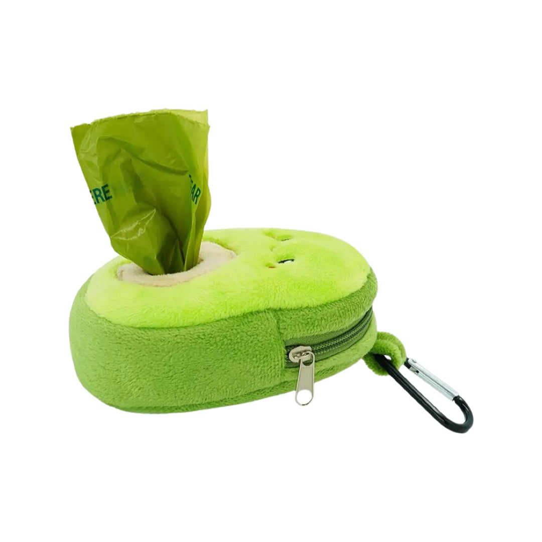Side view of a Plush green avocado dog poop bag holder with a smiley face and a bag sticking out of the opening for it.