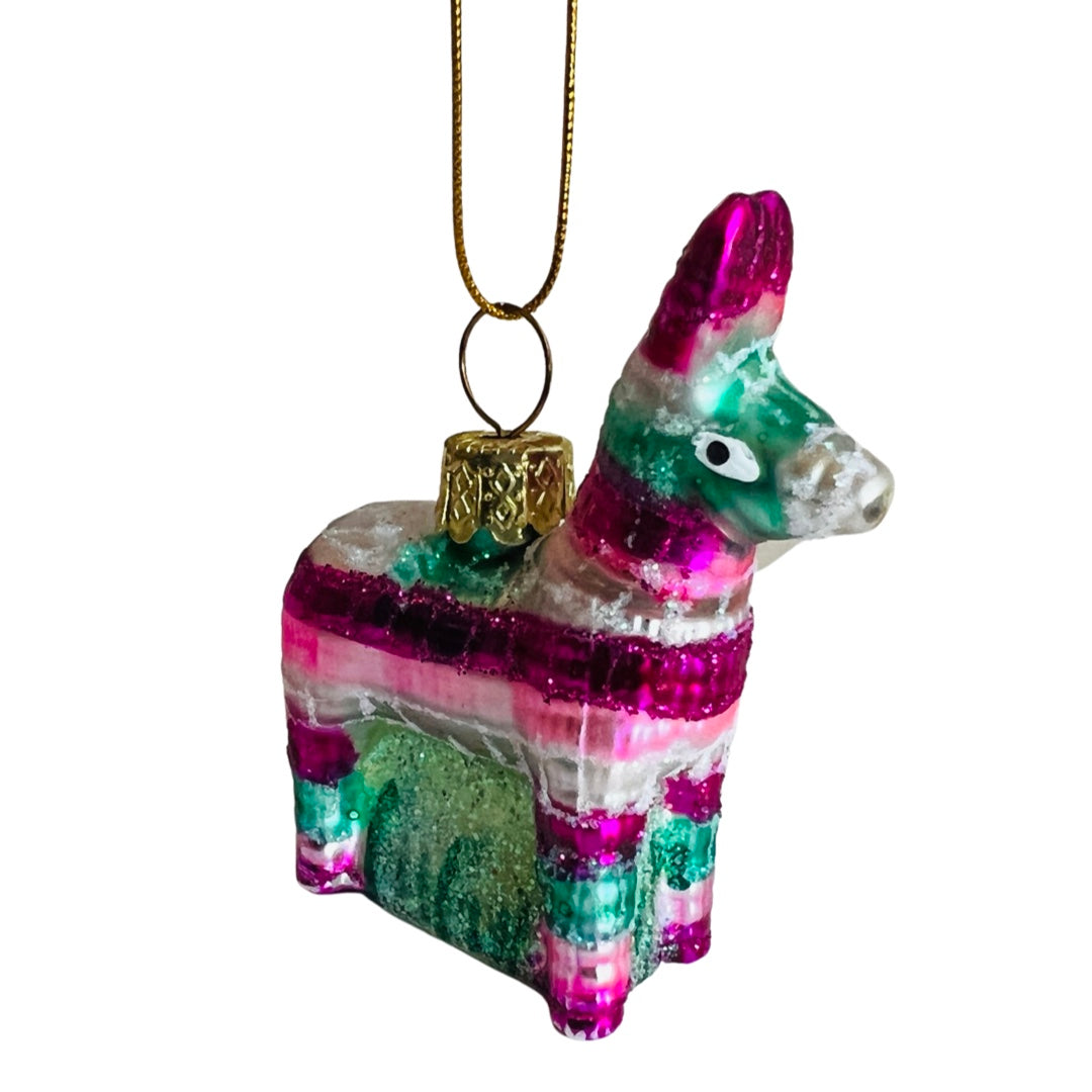 Glass Christmas ornament that looks like a pink, white, & green donkey piñata