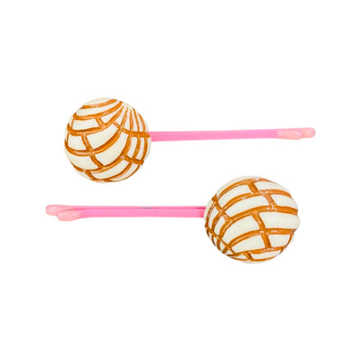 White concha (type of Mexican sweet bread) bobby pins.
