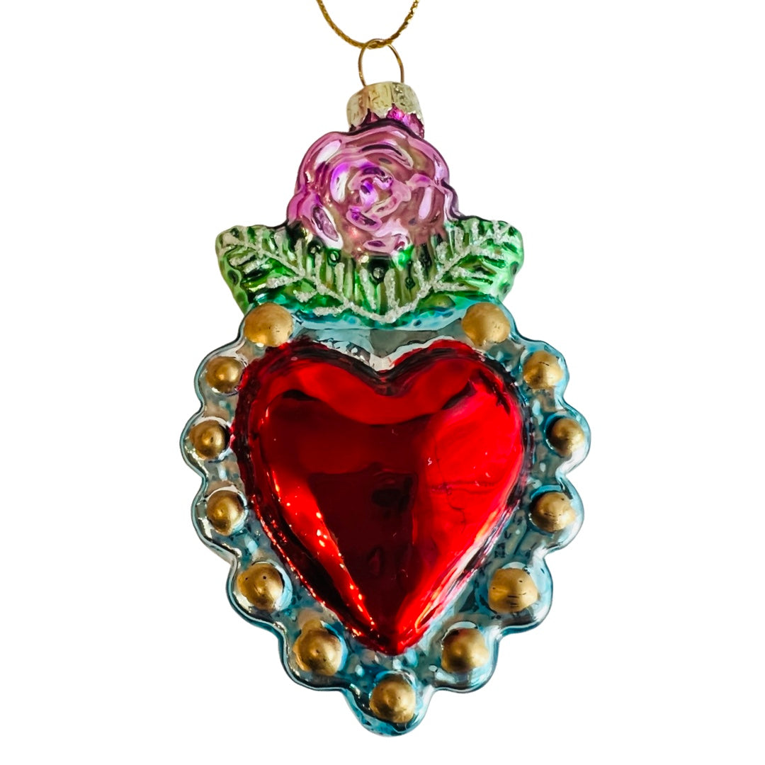 Hand-painted glass milagro heart ornament (style 2). Red heart with gold bead boarder and pink single rose on top.