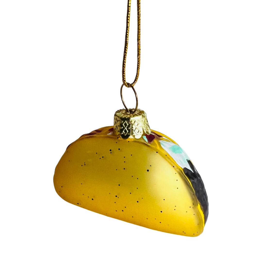 Glass christmas ornament that looks like a taco