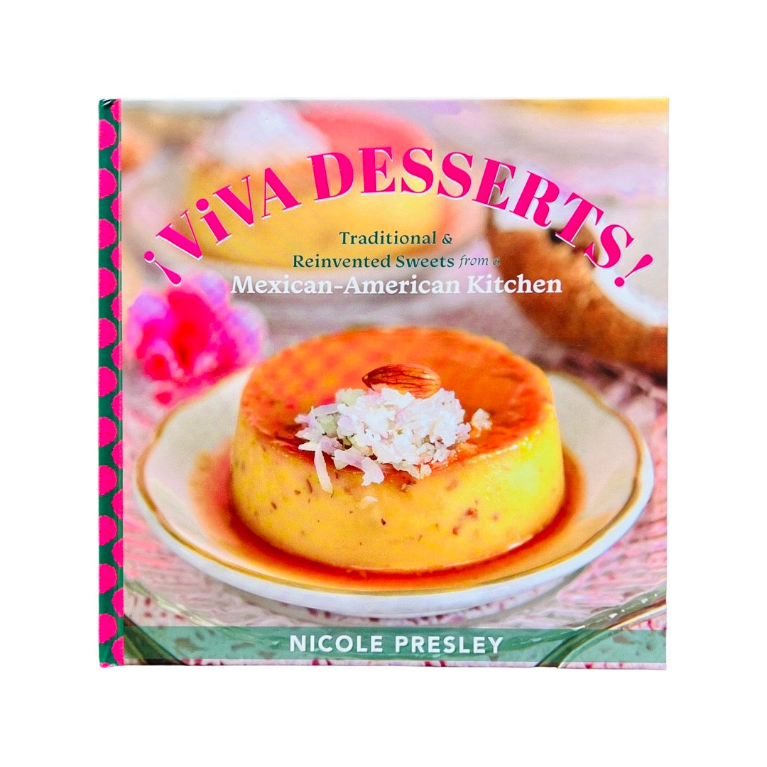 Book cover with a plate of Mexican flan with an almond and coconut flake topping. The title, Viva Desserts, is curved on top in pink lettering. 