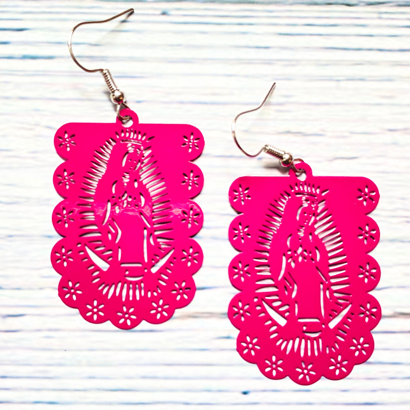 Pink laser cut metal Virgen de Guadalupe earrings.