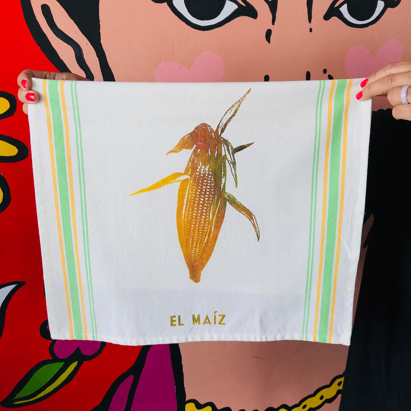 Hand-painted and handprinted El Maíz Loteria themed kitchen towel in a neon theme