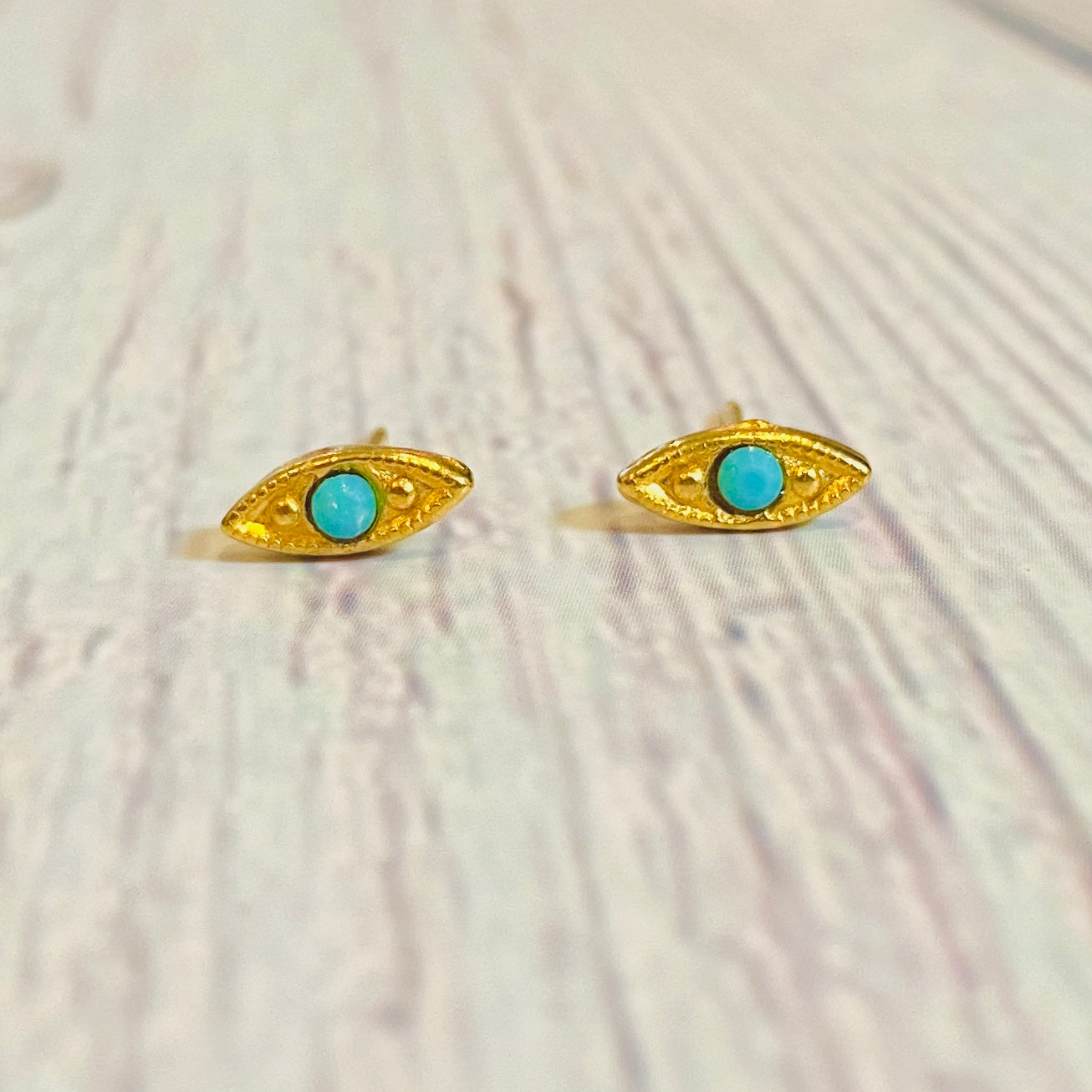 Gold plated brass turquoise eye stud earrings. 