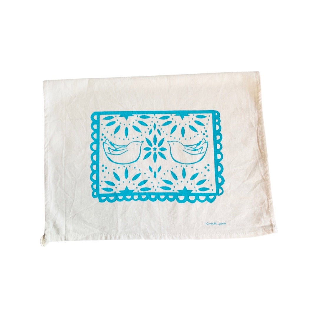 Light blue papel picado tea towel with two doves. 