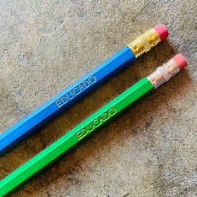 Educado phrase pencils in bright blue and bright green.