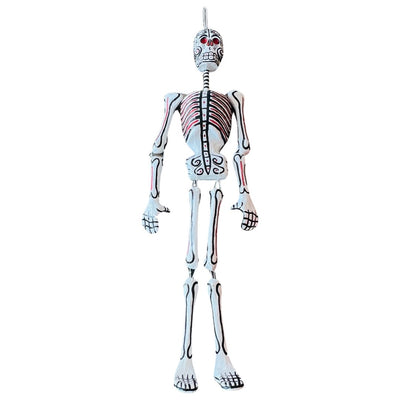 Life size paper mache skeleton with pink glitter on the ribs and eyes.