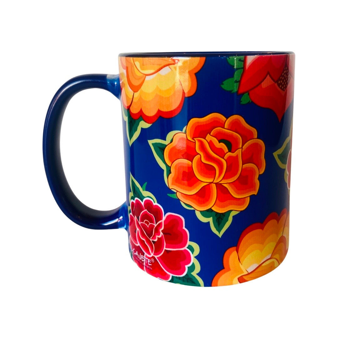 Tehuana mug features brightly colored flowers with dark blue background. 