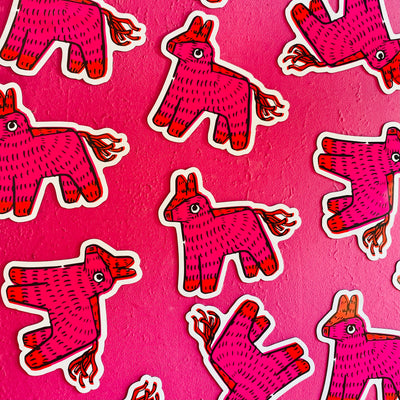 Pink wall with various pink piñata magnets
