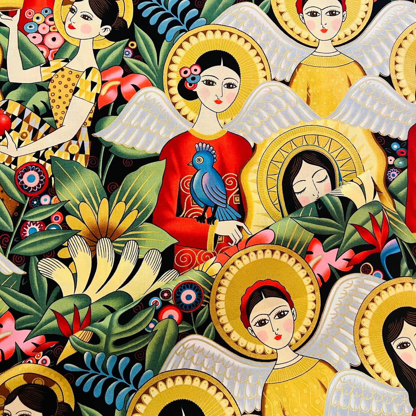 Images is of various angels in different outfits as well as birds, flowers and foliage. 