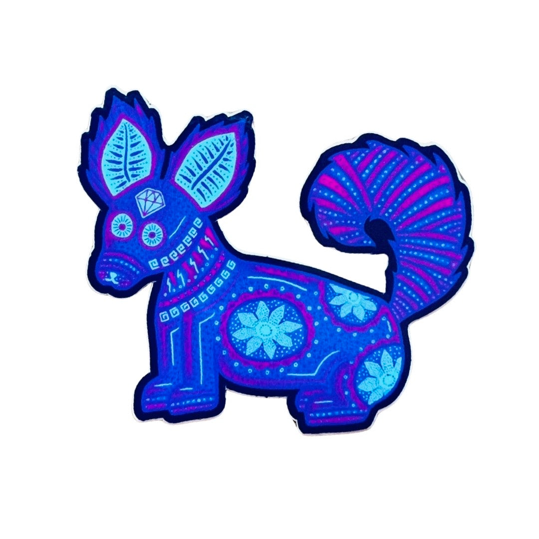 A purple alebrije, Mexican animal guide, with an teal and pink design throughout its body.