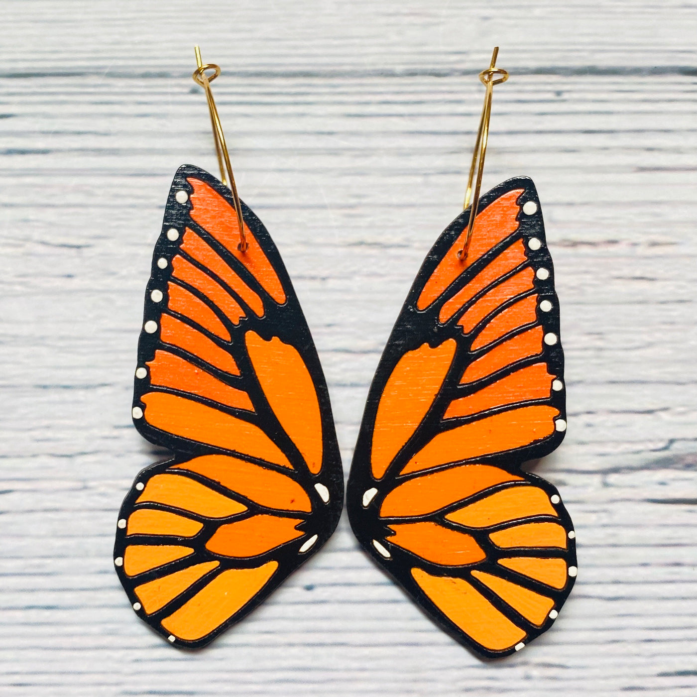 Monarch butterfly wood hoop earrings.