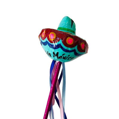 Sombrero paper mache shaker with colorful ribbons. 