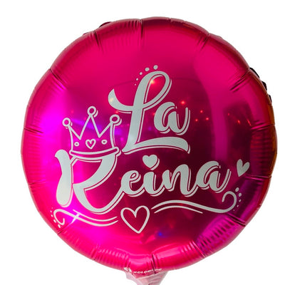 Hot pink circular balloon that reads, "La Reina". Graphic includes crown on top of the R in reina and hearts. White & cursive font. 