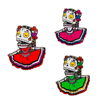 3 Folklorico Calavera Enamel pins with each one featuring a different color dress; green, red and pink