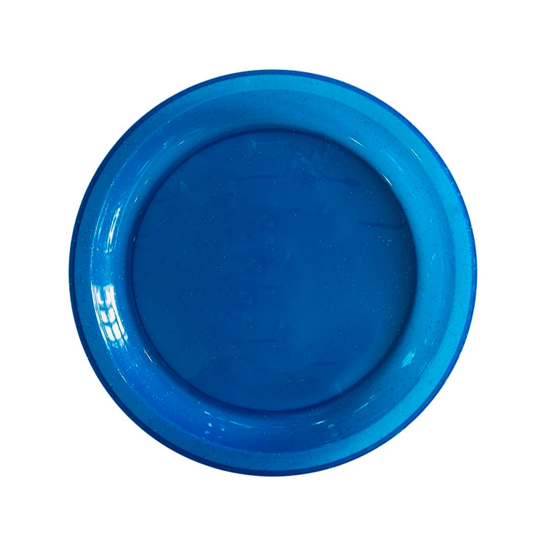 Top view of large plastic blue glitter plate.