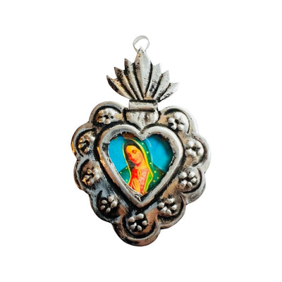 Silver tin Sacred heart frame with the Virgen de Guadalupe in the center.