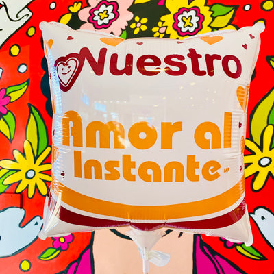 Maruchan (instant ramen) themed square balloon that reads, "Nuestro...Amor Al Instante." Graphic includes light orange hearts.