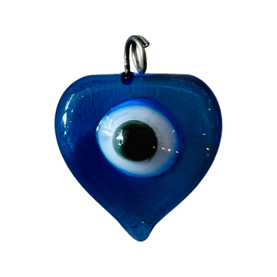 Blue glass evil eye heart that features a white and back circle in the center