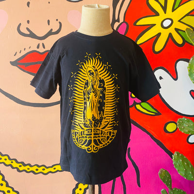Black Virgencita kid's shirt with yellow accent color on mannequin. 