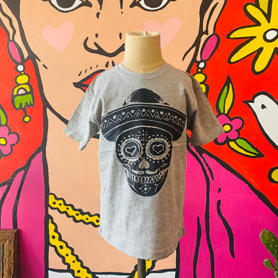 Gray Mariachi Calavera kid's t-shirt with black detail pictured on mannequin.