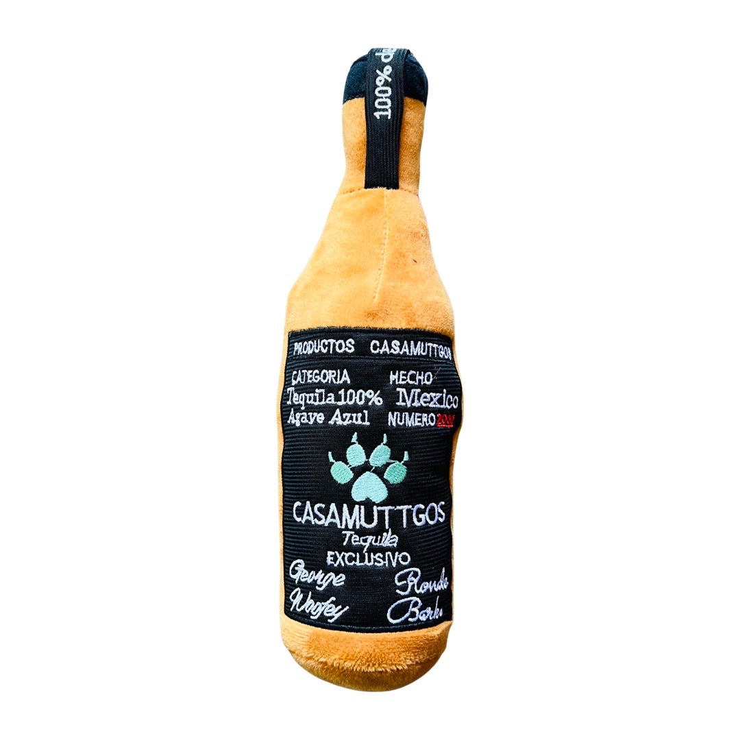 Squeaky plush tequila bottle dog toy.