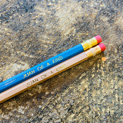 Juan Of A Kind phrase pencils in blue and natural.