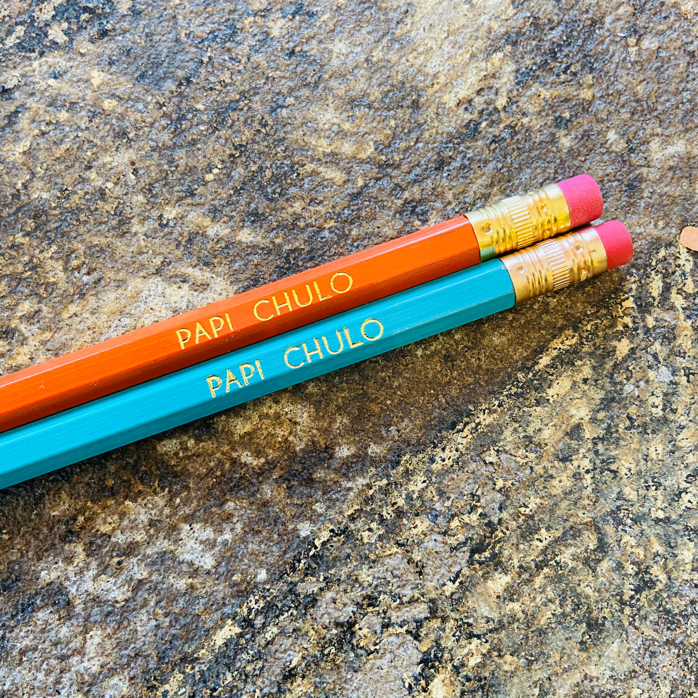 Papi Chulo phrase pencils in orange and blue.