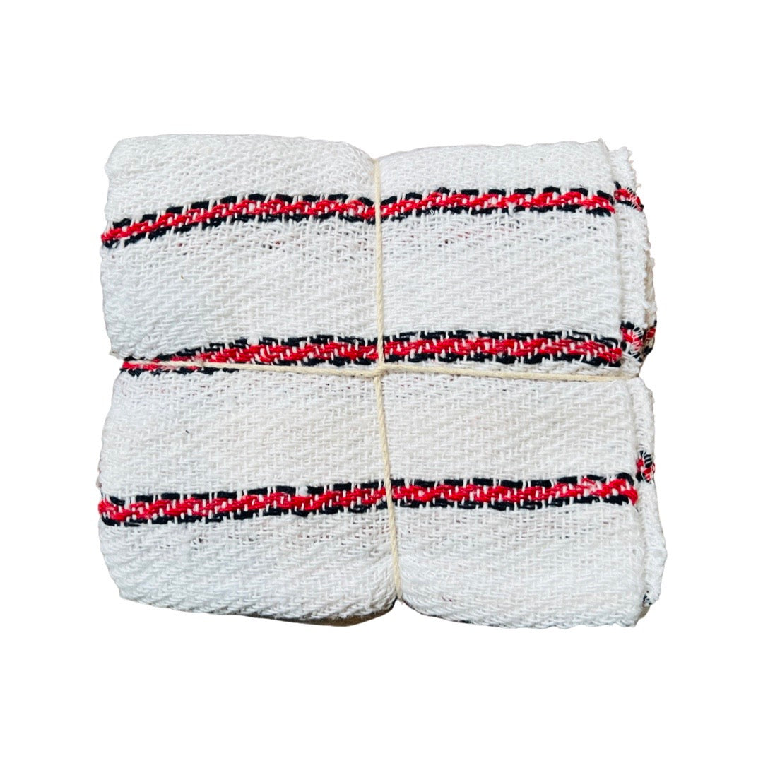 Mexican cotton kitchen towels in white with red stripes folded and tied with a string. 