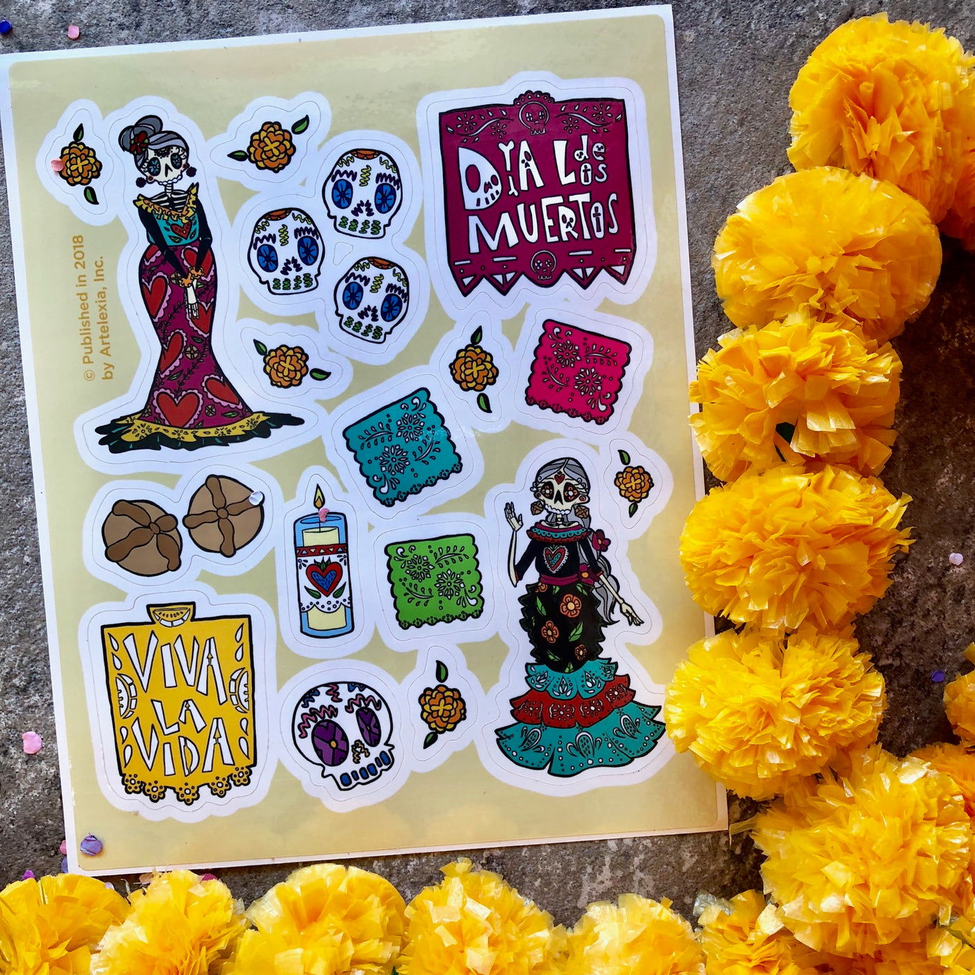 Day of the Dead vinyl sticker sheet with calaveras, paper picador, pan de muerto and sugar skull stickers.