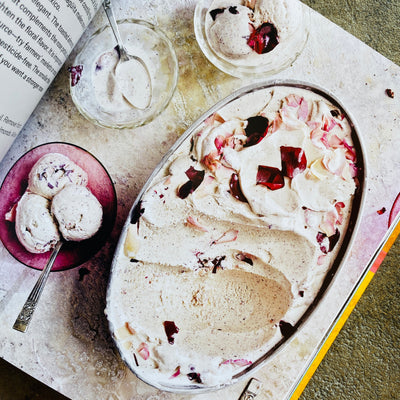 Top view of inside Mexican Ice Cream: Beloved Recipes and Stories cookbook. Image features 3 small bowls of ice cream next to large serving bowl of ice cream.