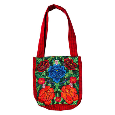 Woven red tote bag with embroidered red, blue and orange flowers on the front.