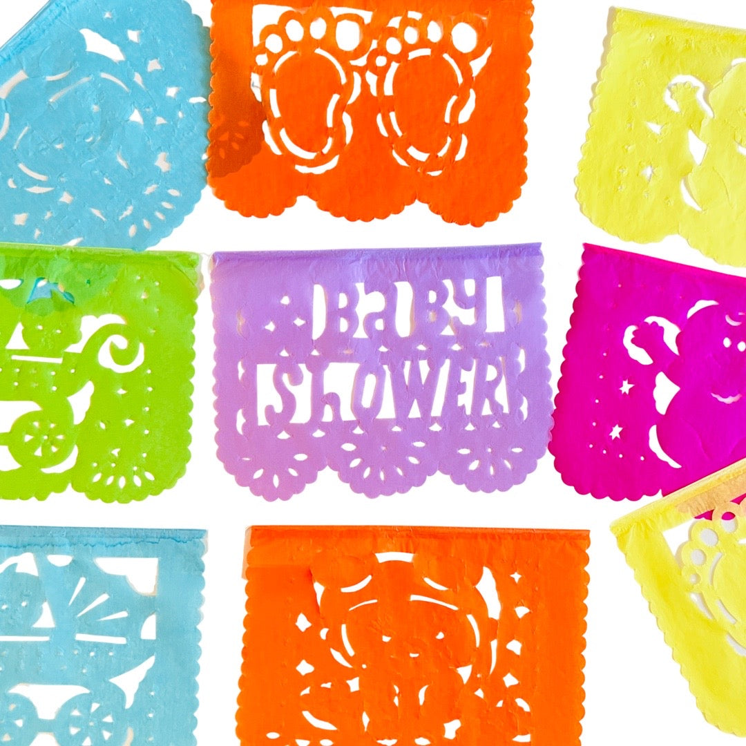 Baby shower papel picado banner in various colors and various baby related designs. Papel picado , or perforated paper, is a traditional Mexican decorative craft made by cutting elaborate designs into sheets of tissue paper.
