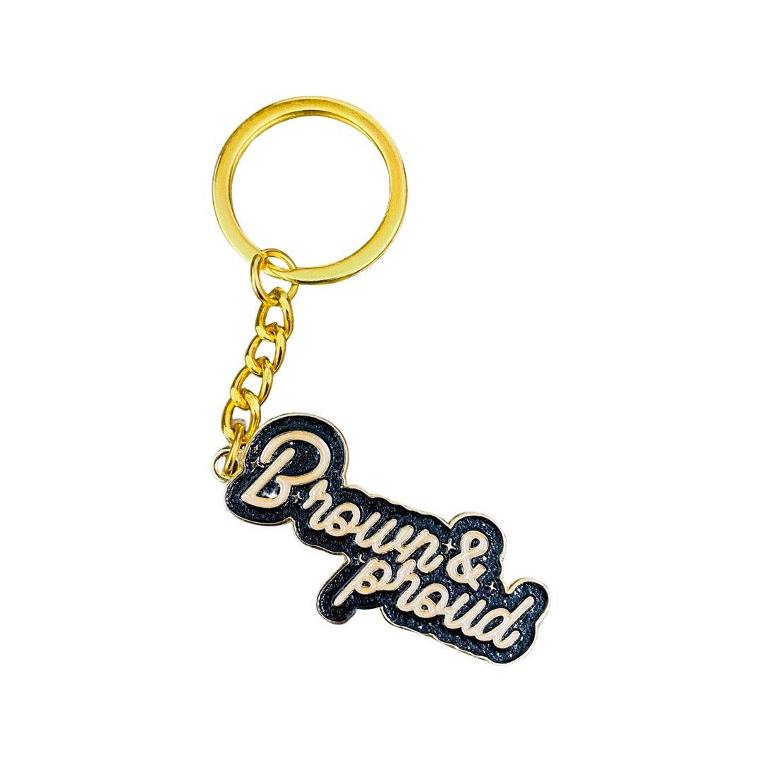 Enamel Keychain of the phrase Brown & Proud in brown and black letters